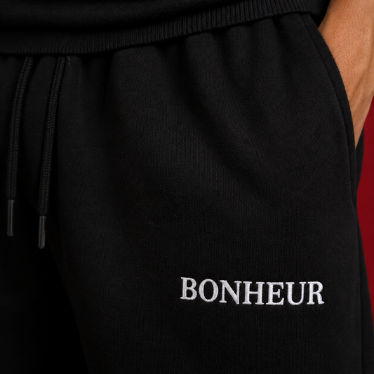 Soft gray BONHEUR sweatpants made from 400GSM fabric, featuring a relaxed fit and elastic waistband for comfortable wear.