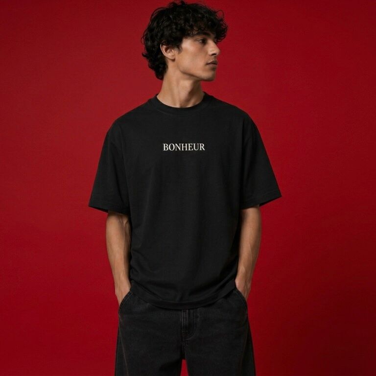 Unisex oversized T-shirt by BONHEUR, 180 GSM, shown in a relaxed fit with soft fabric and simple design.