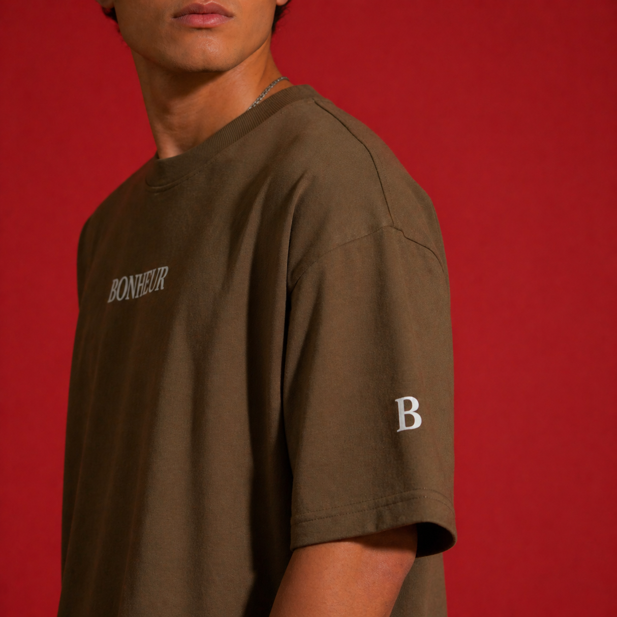 Unisex oversized Bonheur 240GSM T-shirt in soft fabric, shown in a relaxed fit with short sleeves and casual style.